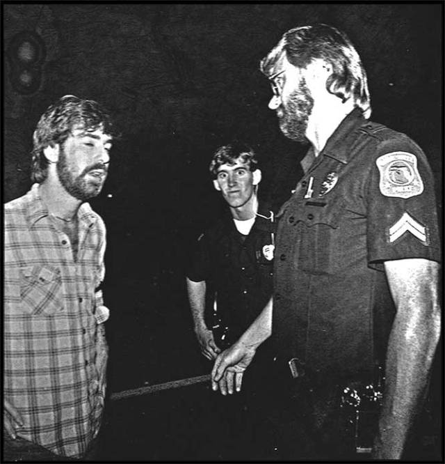 Cops detaining Michael Koretzky for what is surely nothing.